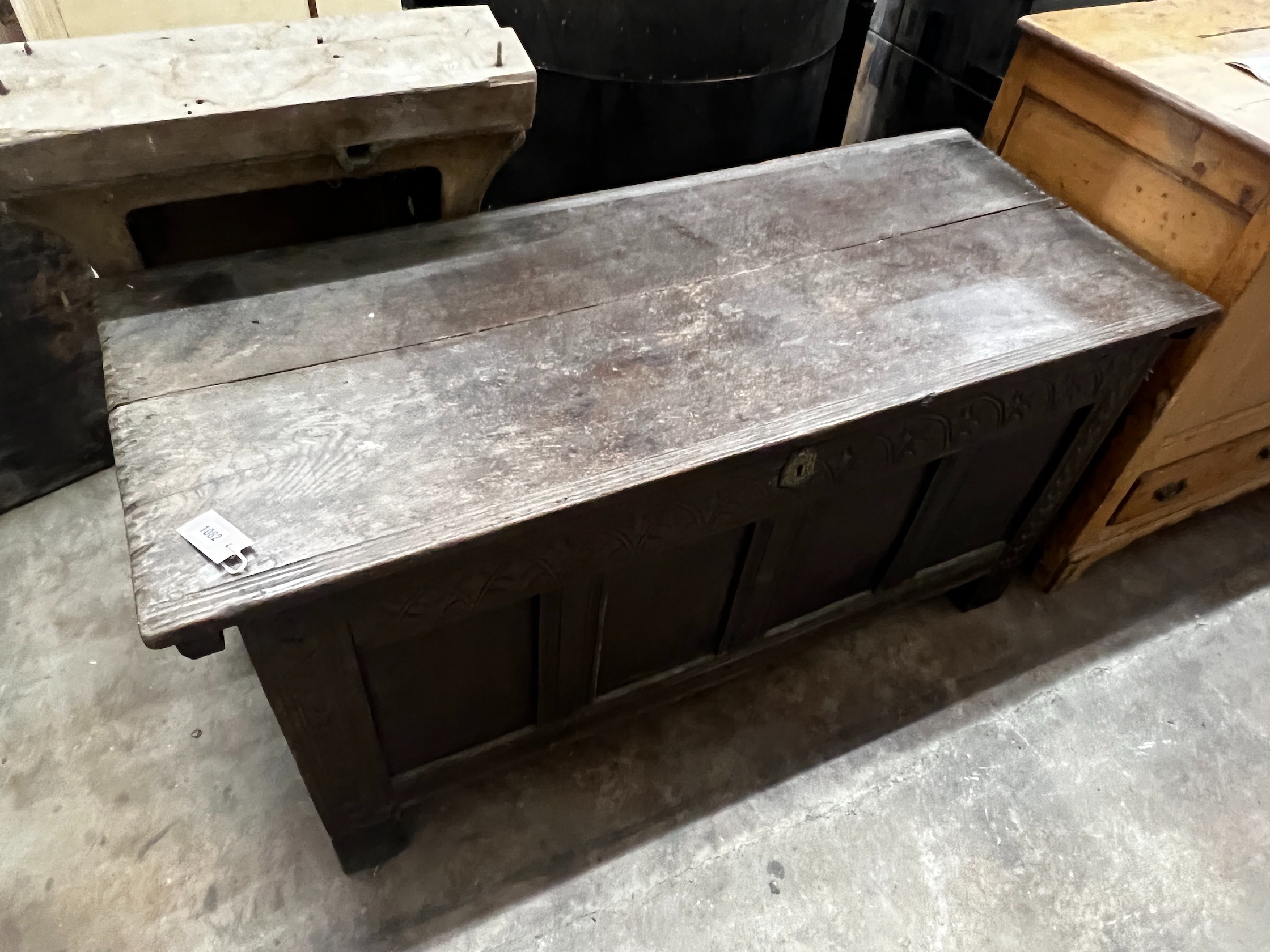 An 18th century panelled oak coffer, width 129cm depth 53cm height 63cm